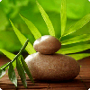Denise Owen Massage Therapy - stones on bamboo